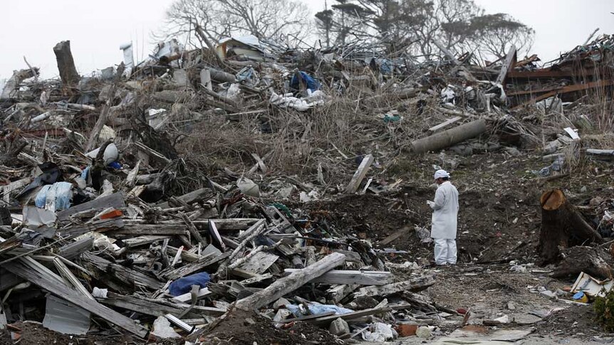 Norio Kimura, 49, who lost his father, wife and daughter in the March 11, 2011 tsunami, checks radiation levels on February 23, 2015.