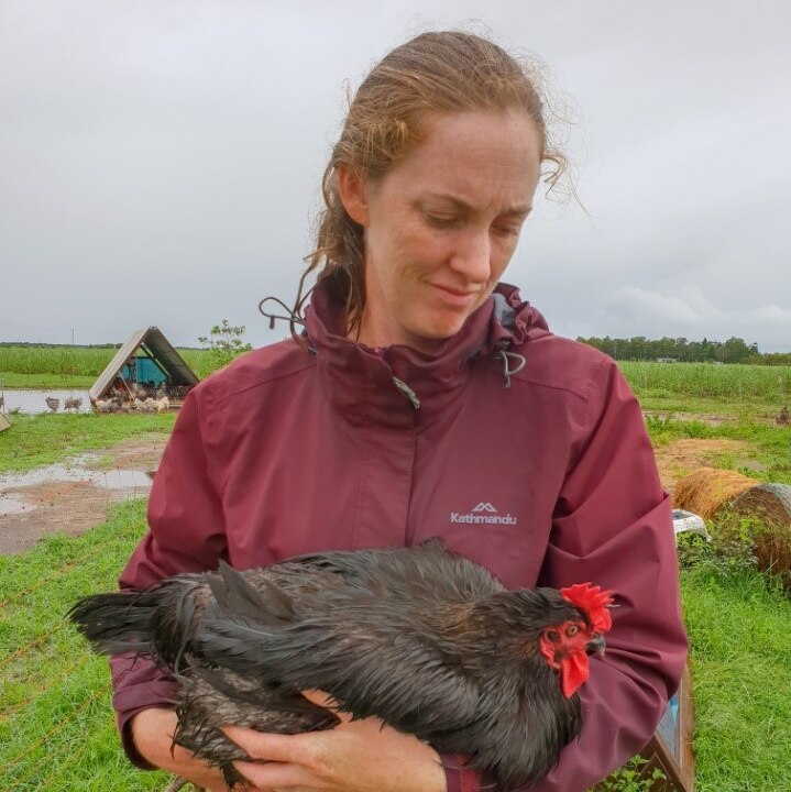 Leanne Cordner holdeing one of her chickens.