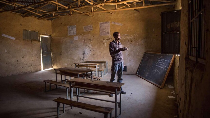 Teacher at empty schoolroom in Ethiopia