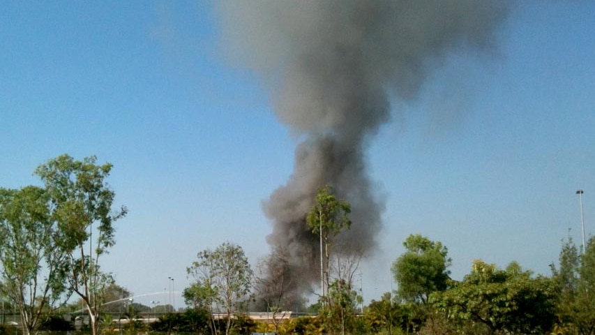 Smoke billows from the immigration detention centre in Darwin