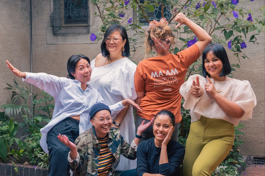 A group of Filipina women posing in fun poses. 