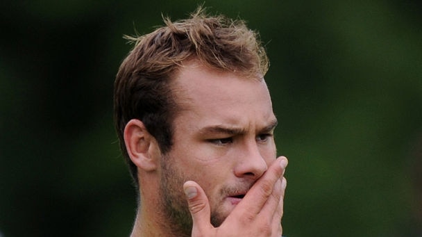 Manly's Brett Stewart with his hand over his mouth at a training session