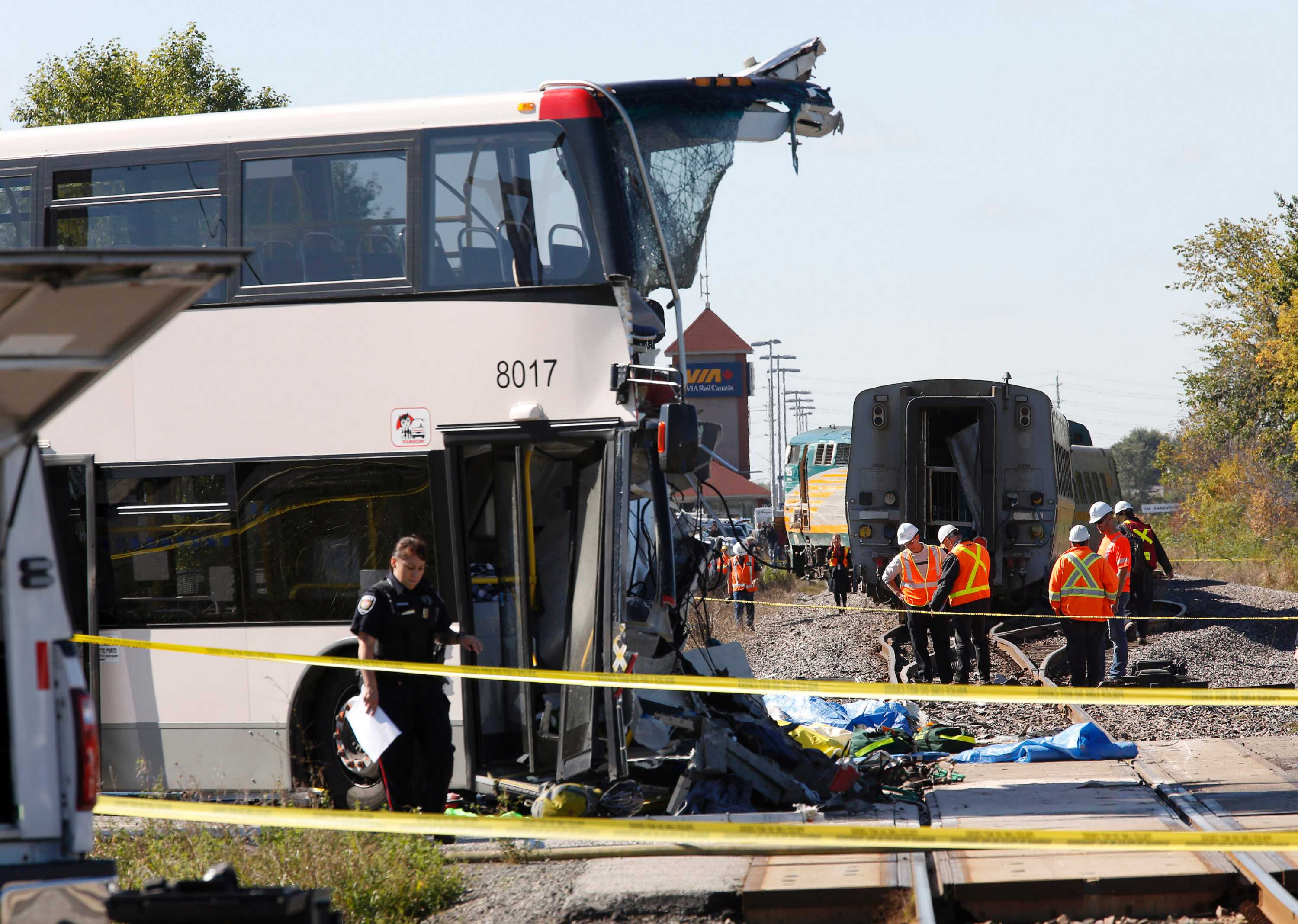 Six killed after double-decker bus and passenger train collide in ...