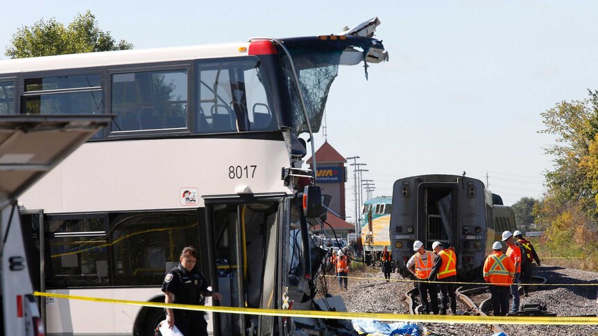 A passenger train collided with a double-decker city bus on the outskirts of Ottawa and derailed, killing six people.