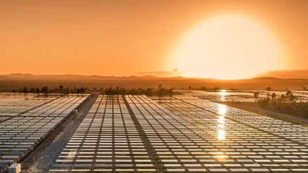 Solar farm in southern Queensland with glowing sunset.