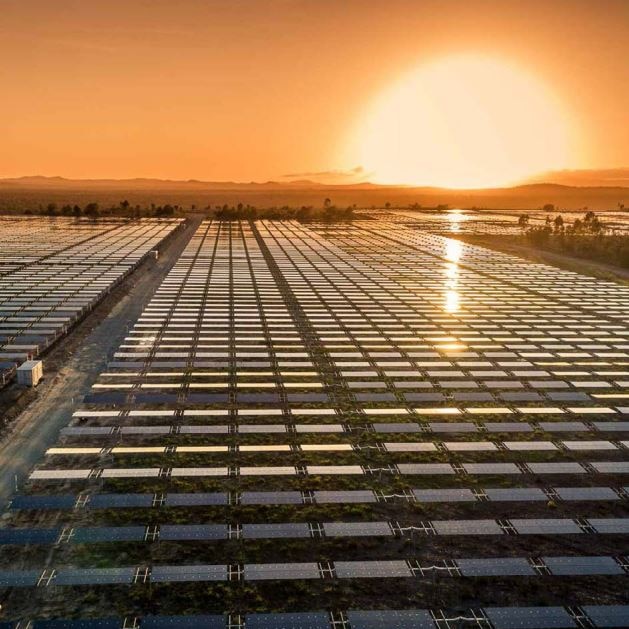 Solar farm in southern Queensland with glowing sunset.