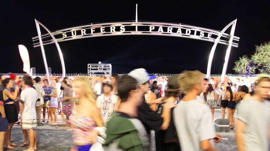 Crowds of people at the Surfers Paradise sign.