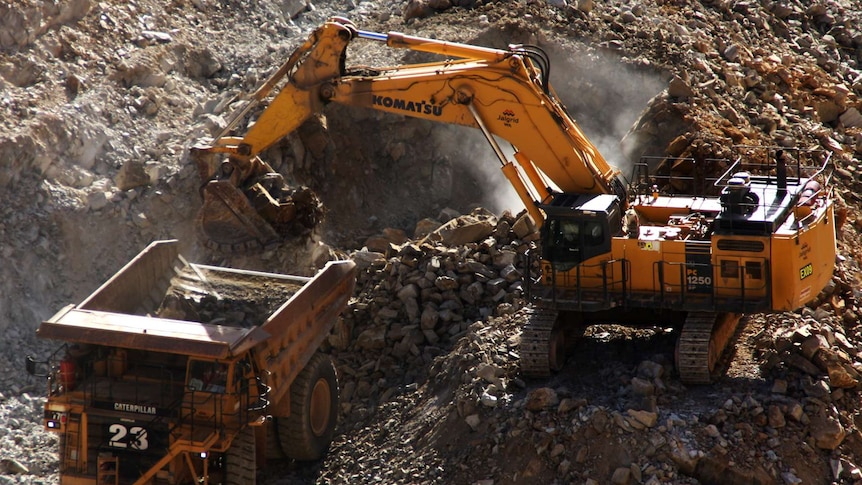 A haulpak is loaded at a mine