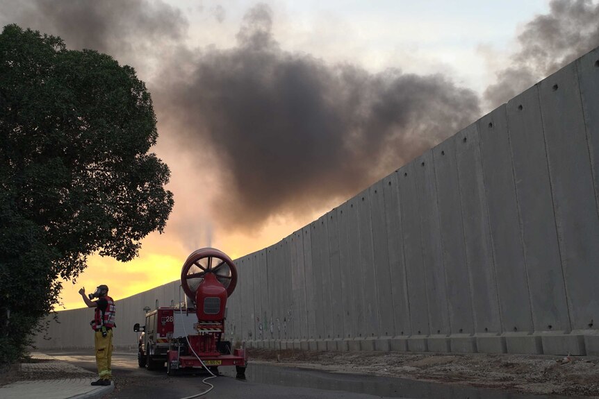 Firefighters use ventilators to disperse smoke that causes problems for Israeli communities.