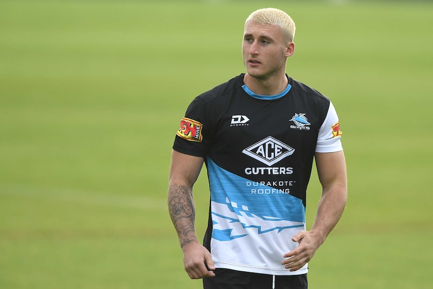 A Cronulla NRL player looks on during a training session.