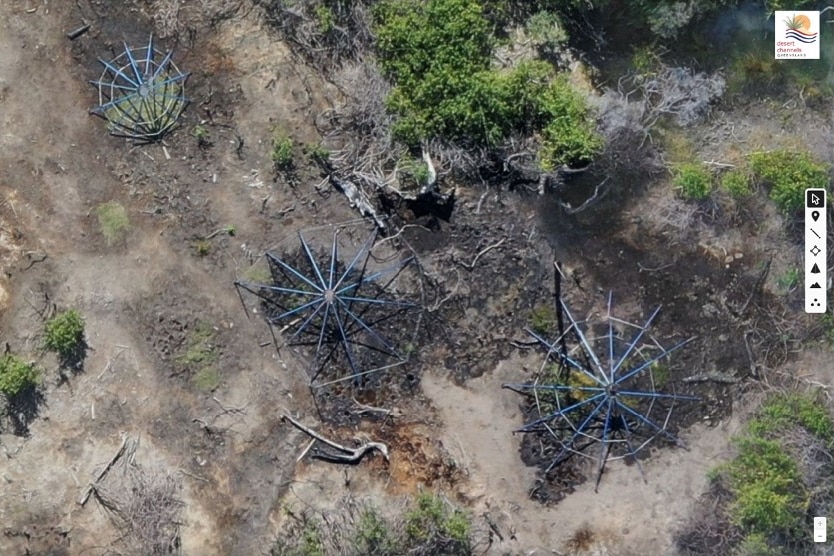 A birds eye view of three structures protecting emerging springs 