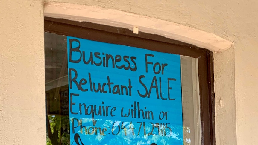 A handwritten for sale sign in the window of a corner store in Boorowa, in southern New South Wales