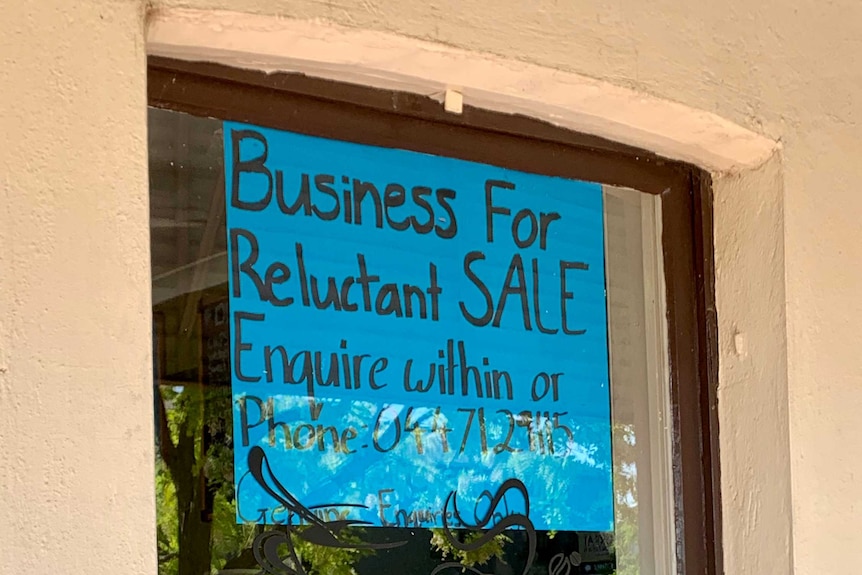 A handwritten for sale sign in the window of a corner store in Boorowa, in southern New South Wales