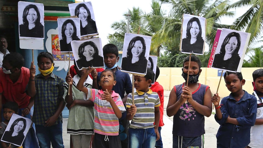 Indian children hold placards of U.S. Vice President-elect Kamala Harris