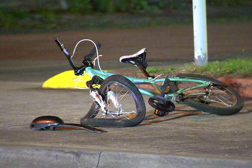 A mangled bicycle left on the footpath at the scene of the hit-and-run.