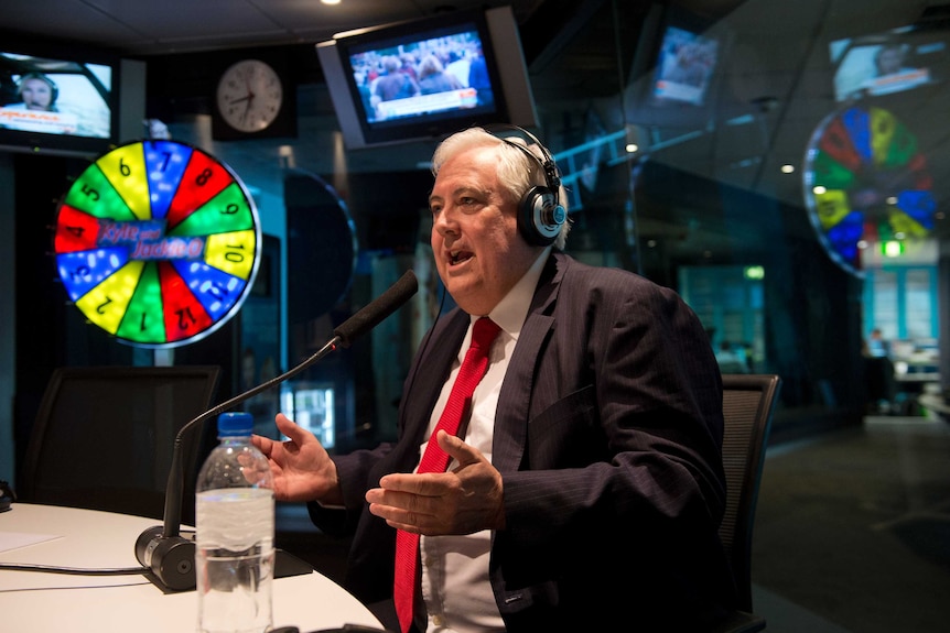 Clive Palmer gestures during a breakfast radio interview on the Kyle and Jackie O show