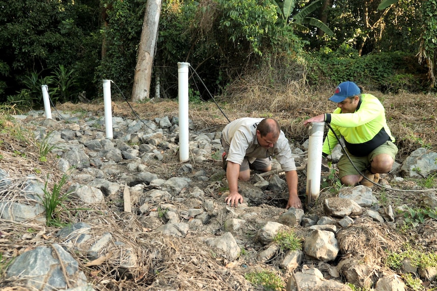 Shaun Morris and Shane White inspecting a bioreactor