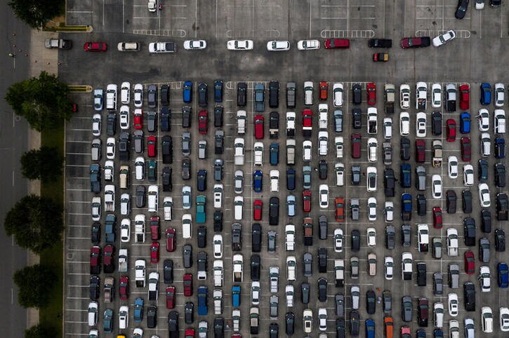 A drone shot of many cars in a car park in San Antonio, Texas