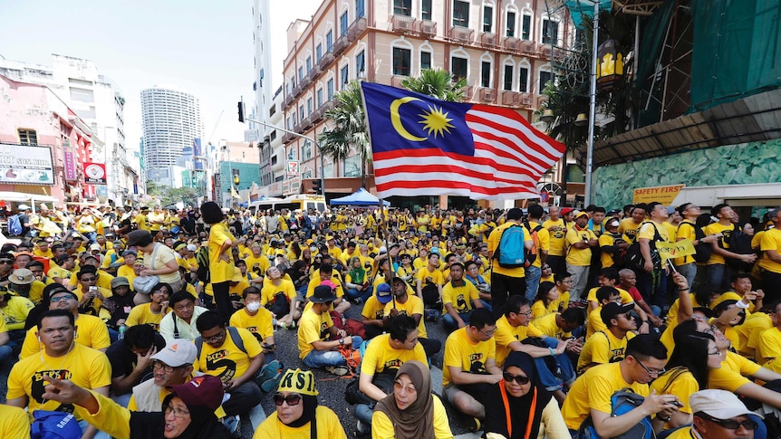 Anti-government protesters occupy a street during a rally in Kuala Lumpur, Malaysia.