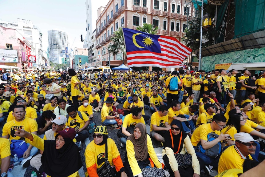 Anti-government protesters occupy a street during a rally in Kuala Lumpur, Malaysia.