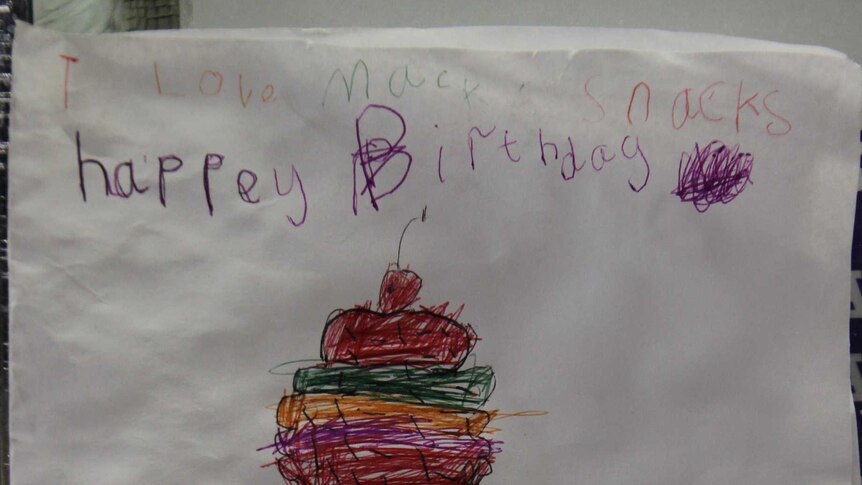 A child-drawn birthday card, wishing a cafe a happy 70th birthday