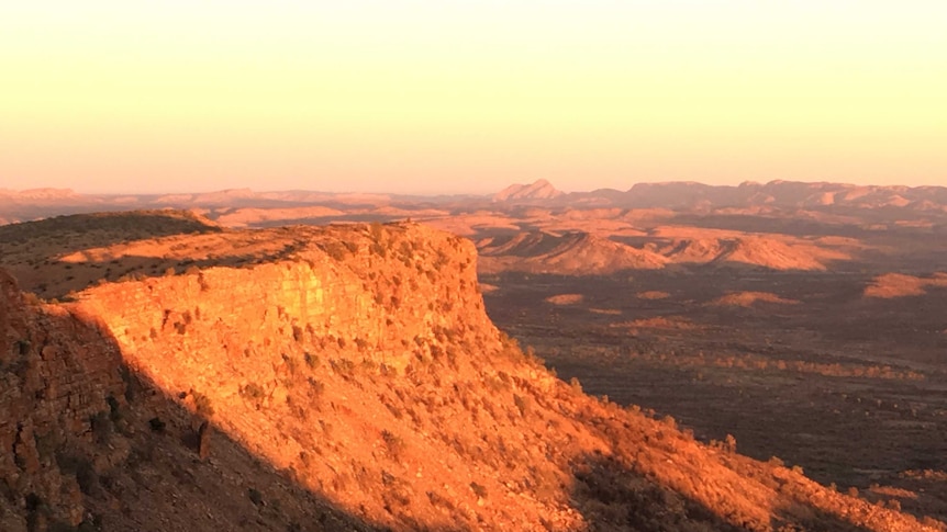The sun shining on Mt Gillen (Alhekulyele) near Alice Springs