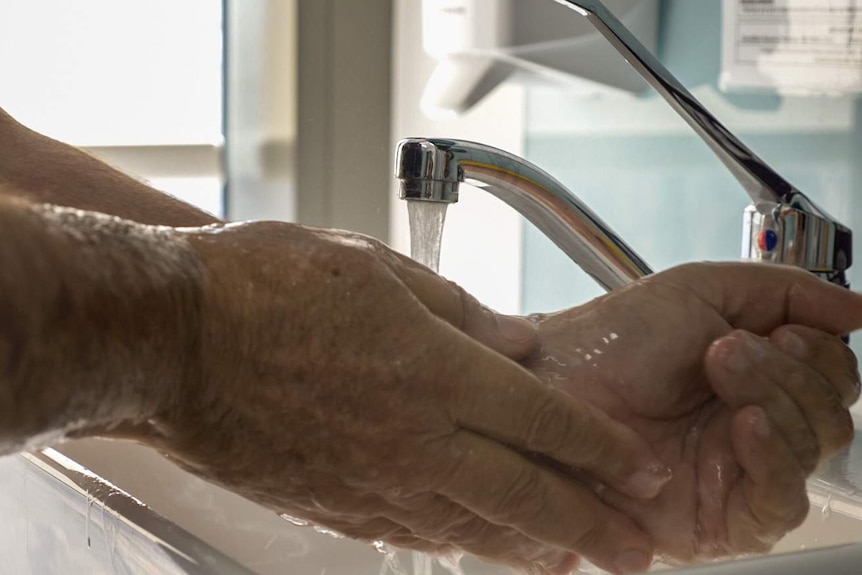 Ian Taylor washing his hands