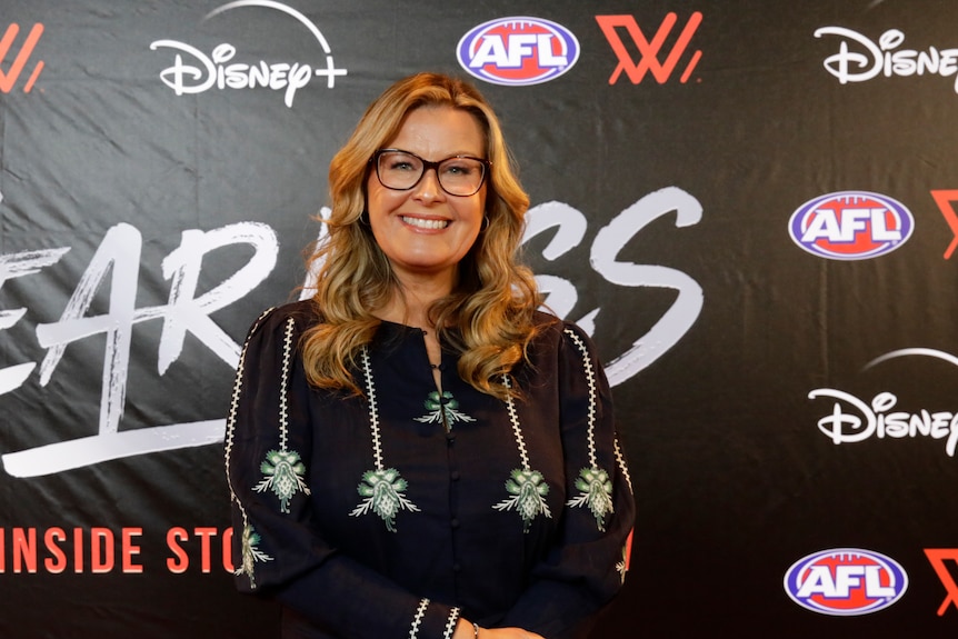 Kylie Watson-Wheeler on a red carpet, posing for a photograph