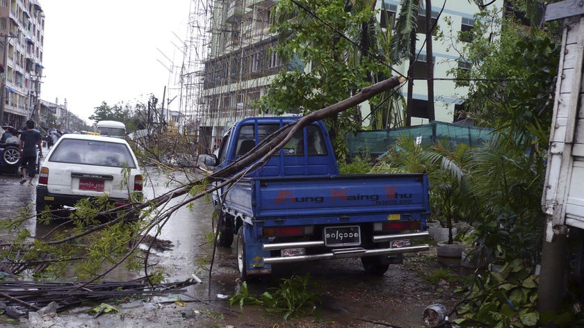 Cyclone Nargis left the streets of the former Burma's main city littered with debris from fallen trees and battered buildings