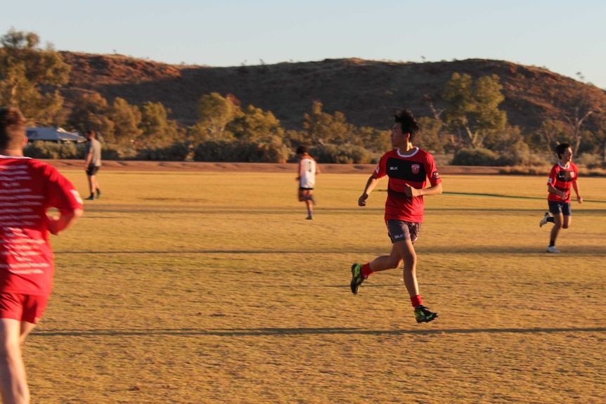 Andre Kim practising football.