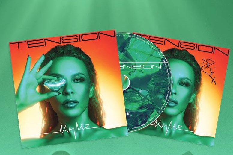 Two CD covers, one of them with a CD falling out. It's the cover of Tension with Kylie Minogue holding a jewel in front of eye