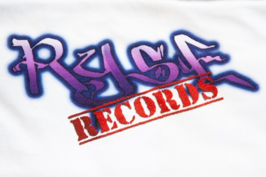 A purple and red logo reading Ryse Records