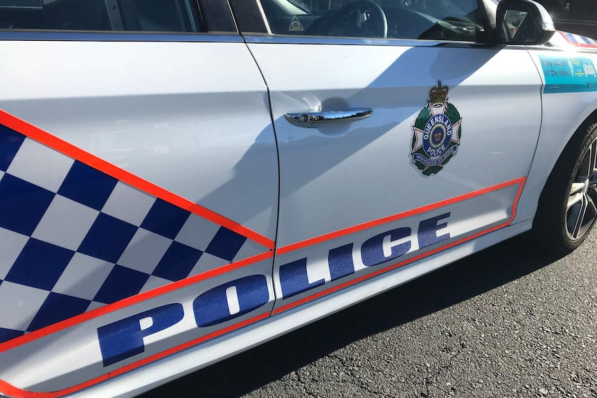 Side photo of Queensland police car.