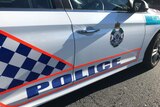 Side photo of Queensland police car in a Brisbane street