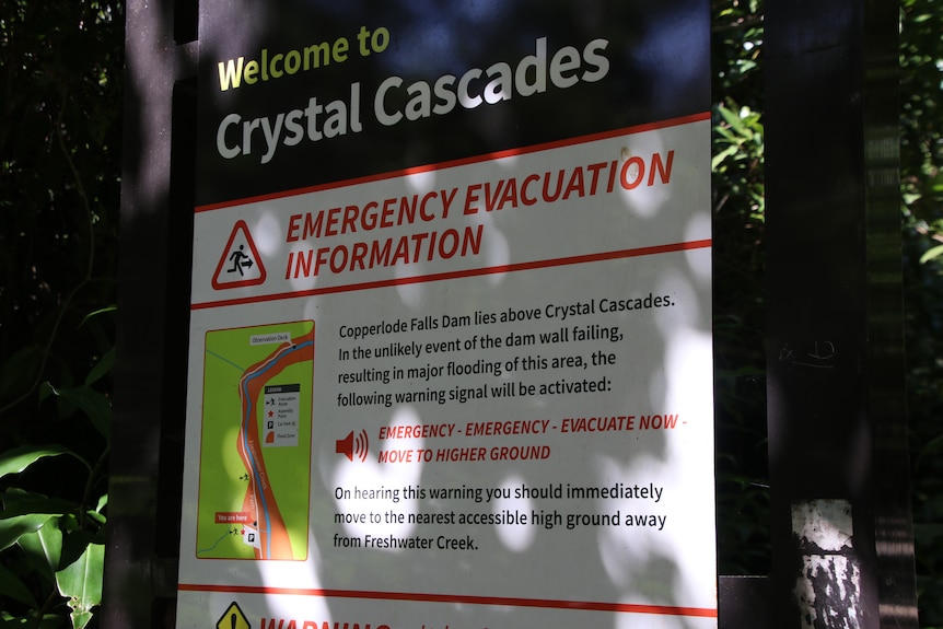 A sign showing emergency evacuation information for Crystal Cascades