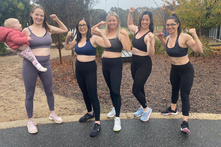 A group of five women posing in their activewear 