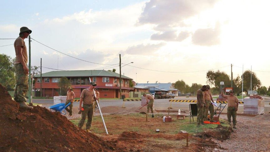Soldiers from Townsville's Third Combat Engineer Regiment working on the Anzac Memorial Garden in the outback town of Boulia