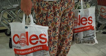 Woman holding plastic bags