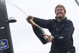 French skipper Francois Gabart sprays champagne