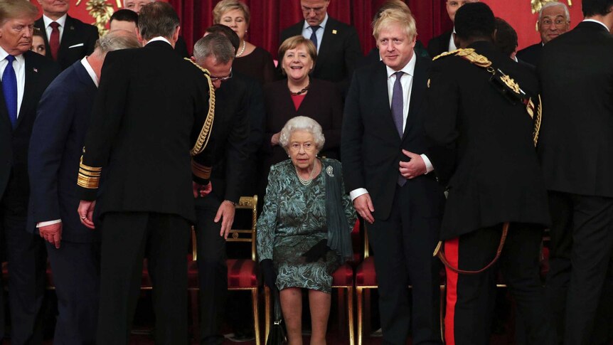 Queen Elizabeth is surrounded by world leaders at Buckingham Palace