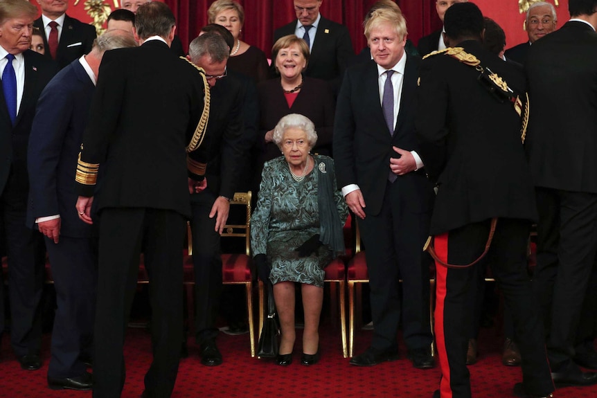 Queen Elizabeth is surrounded by world leaders at Buckingham Palace