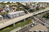 A digital drawing of a raised train line running along a freeway with houses and the city skyline in the background.