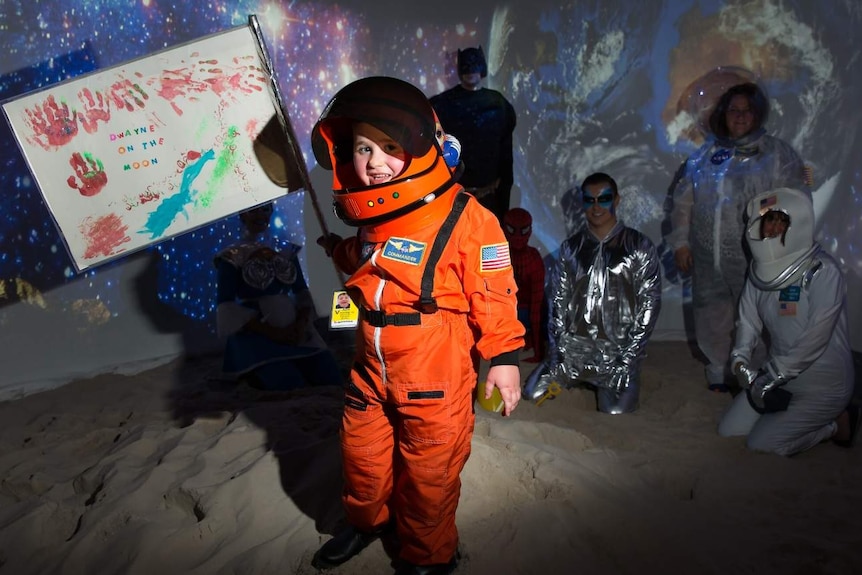 Dwayne Franke plants his flag on the moon.