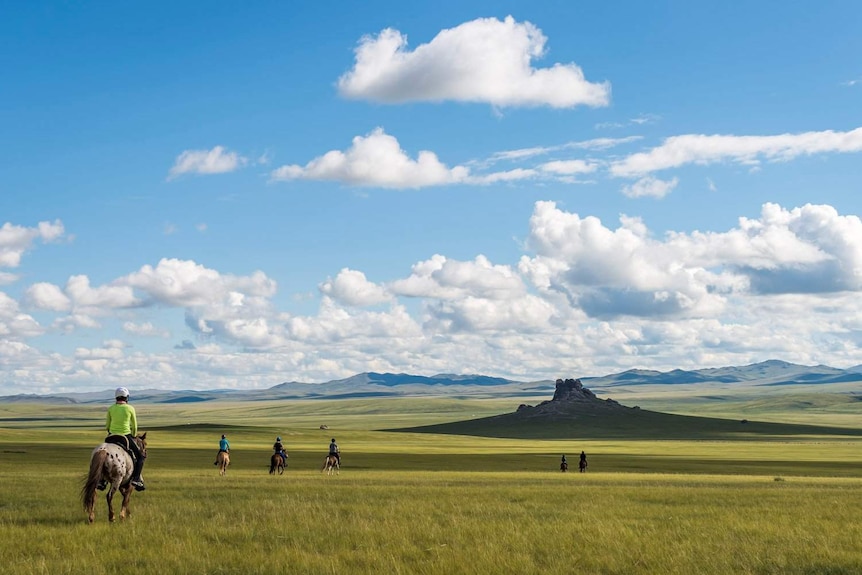 Riders in the Mongolian wilderness.