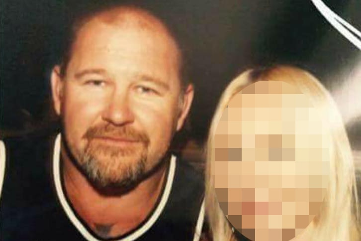 Former Rebel bikie president Nick Martin pictured with a woman whose face is blurred.
