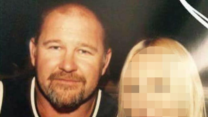 Former Rebel bikie president Nick Martin pictured with a woman whose face is blurred.