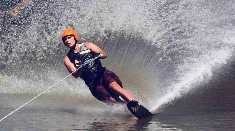 A young blind man, waterskiing