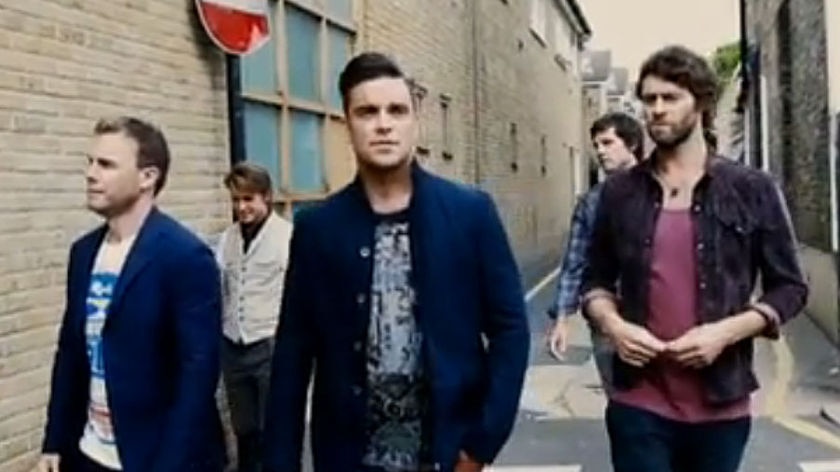 Robbie Williams (centre) and members of Take That