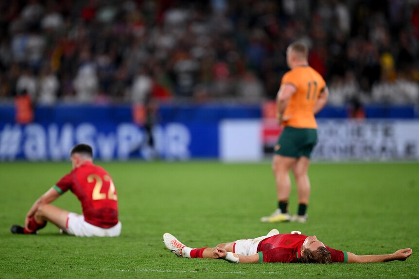 Portugal players lie on the floor