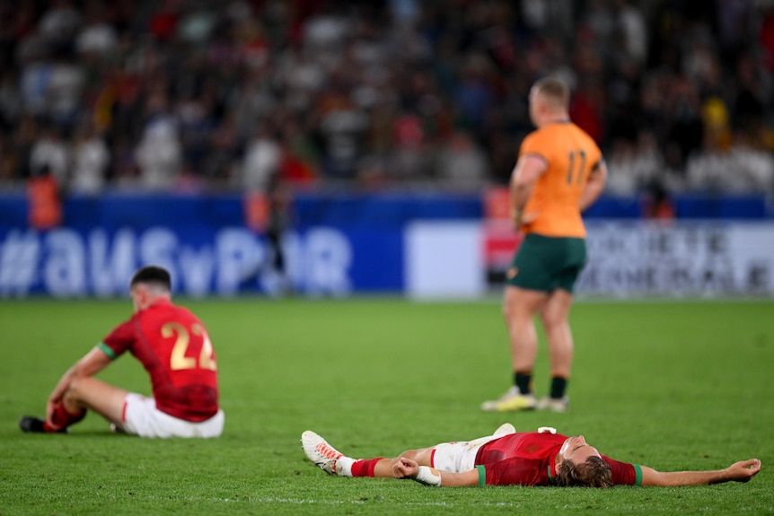 Portugal players lie on the floor